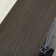 Close-up of the dark wood grain top surface