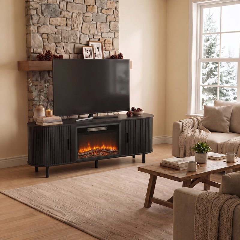 Black electric fireplace TV stand in a living room with a stone wall and a TV on top