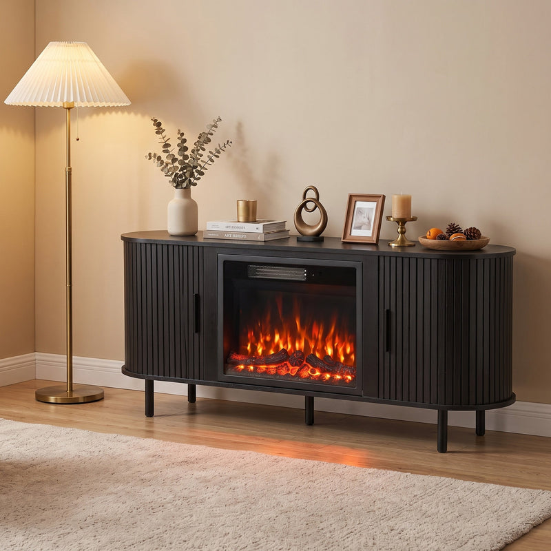 Black fireplace TV stand with decor on top beside a floor lamp