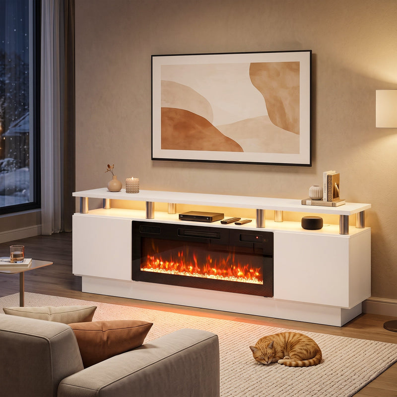 White fireplace TV stand in a living room with a TV above and a cat on the rug