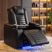 Black electric recliner armchair with footrest raised in a living room with bookshelves