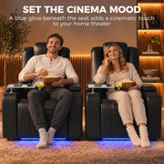 Two black electric recliners side by side with blue LED glow in a home cinema setting
