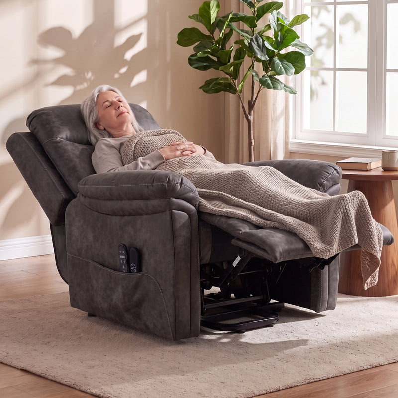 Woman resting under a blanket in the fully reclined riser recliner with the footrest raised