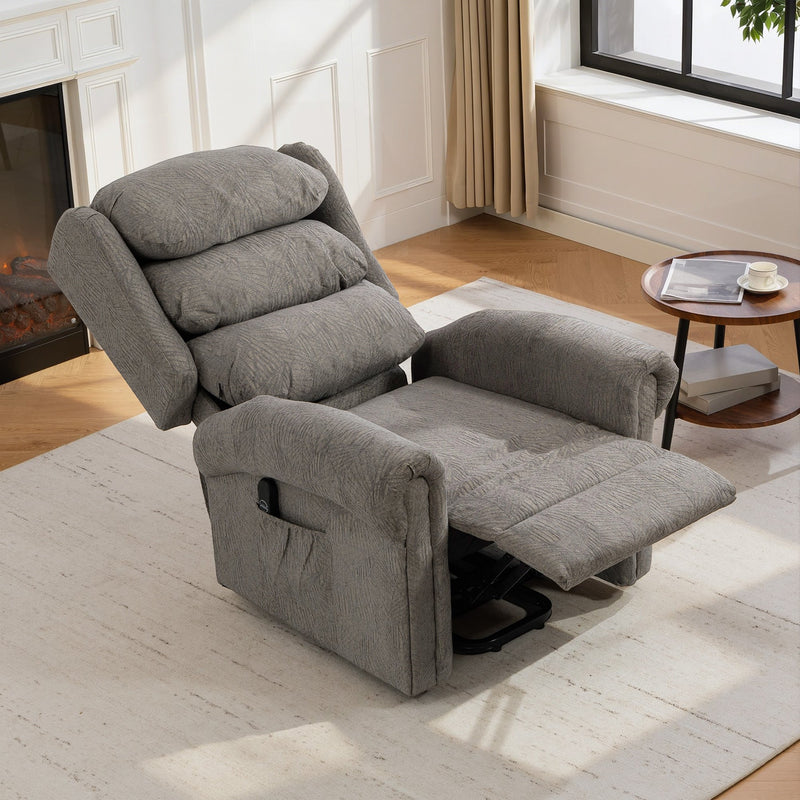 Dark grey recliner fully reclined with footrest raised in a living room