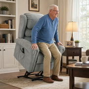 Elderly man standing up with help from the Homcom recliner chair's electric lift function