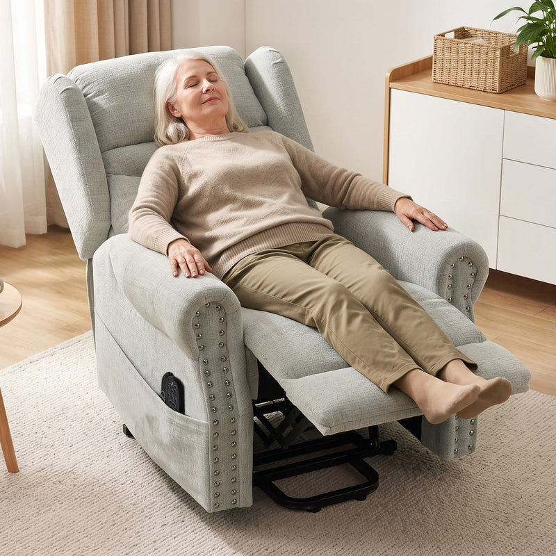 Woman fully reclined in the chair with the footrest extended in a living room setting