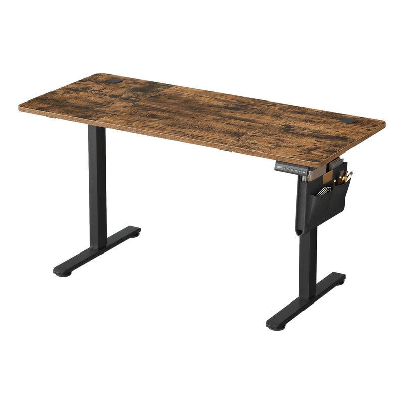 Electric standing desk with rustic brown worktop and black frame, side storage pocket visible