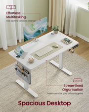 Angled view of the white 100 cm desktop holding a monitor, laptop, keyboard and mug