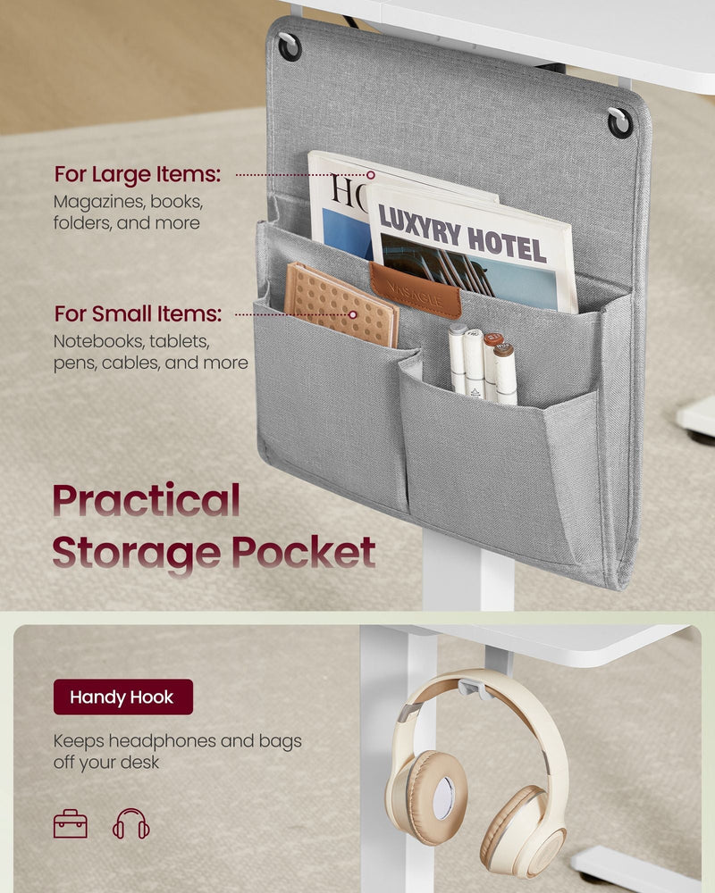 Close-up of the grey two-compartment side storage pocket and the under-desk hook holding headphones