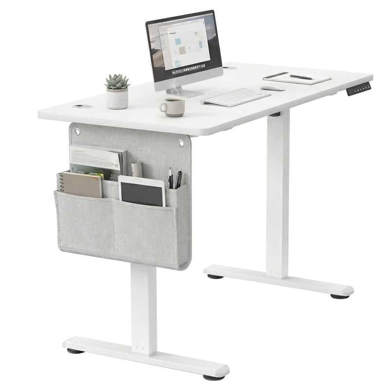 Vasagle standing desk set up with monitor, keyboard and desk organiser, showing storage pocket