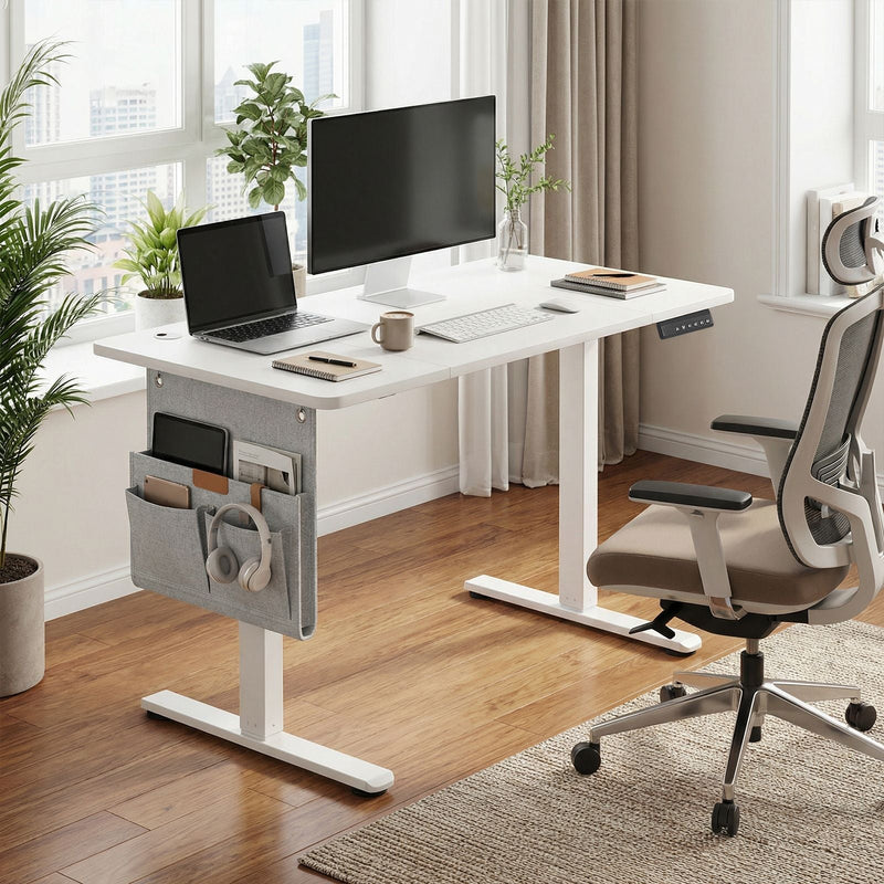 Vasagle standing desk lifestyle shot in a bright home office with laptop and monitor