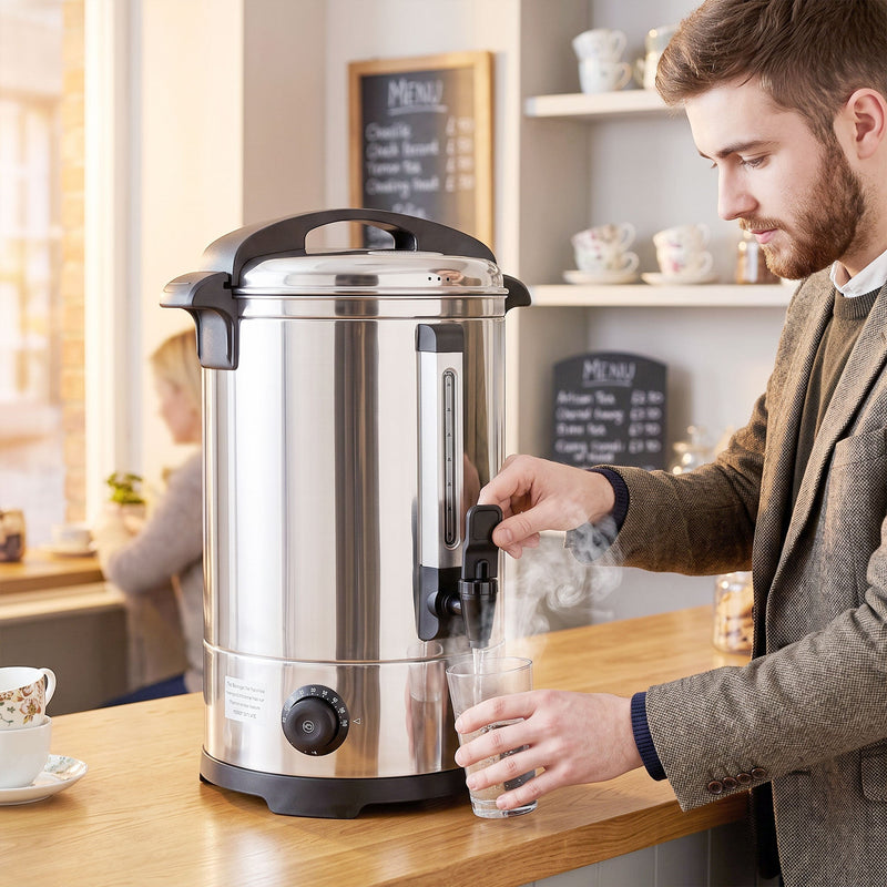 Man filling a glass from the 8L urn behind a cafe counter with a menu board behind