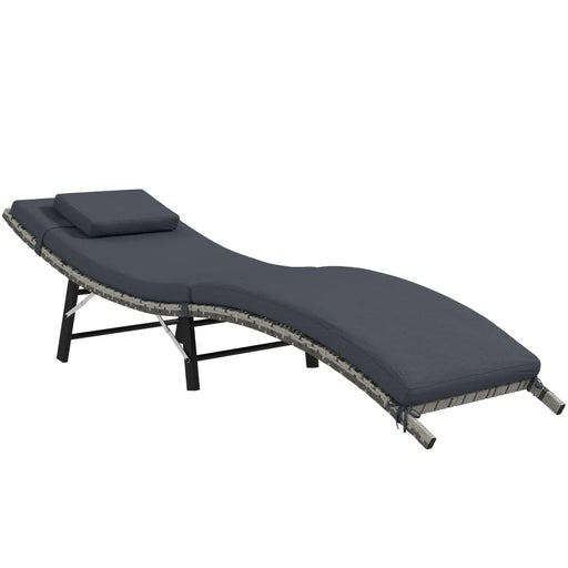 Image of an ergonomic curved rattan sun lounger with dark grey cushion
