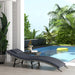 Image of an ergonomic curved rattan sun lounger with dark grey cushion