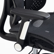 Close-up of a black armrest and mesh seat on a white background