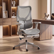 Grey ergonomic mesh office chair beside wooden shelving in a home office