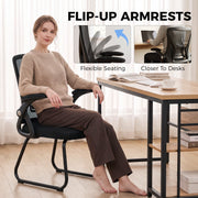 Black mesh office chair shown from a side angle highlighting the sled-style steel legs