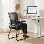 Black mesh office chair styled in a home reception area