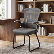 Dark Grey mesh office chair styled in a home study beside a bookshelf