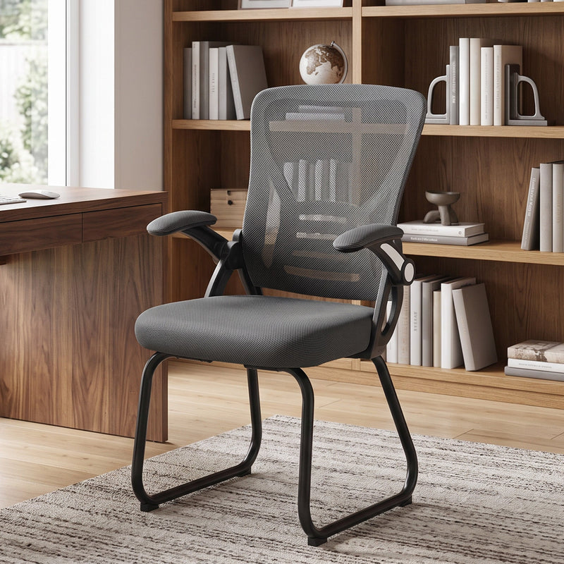 Dark Grey mesh office chair styled in a home study beside a bookshelf
