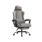 Studio view of the reclining desk chair with fabric-look perforated leather and pull-out footrest