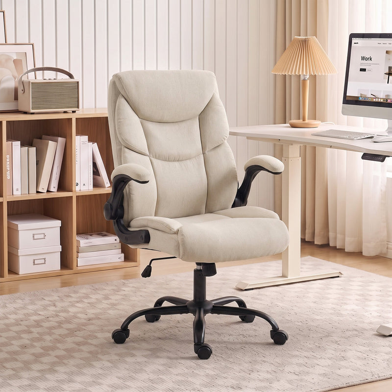 Cream white office chair at a light home office desk beside shelves and a lamp