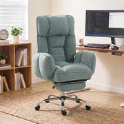 Light green executive office chair in a home study beside a wooden desk and bookcase