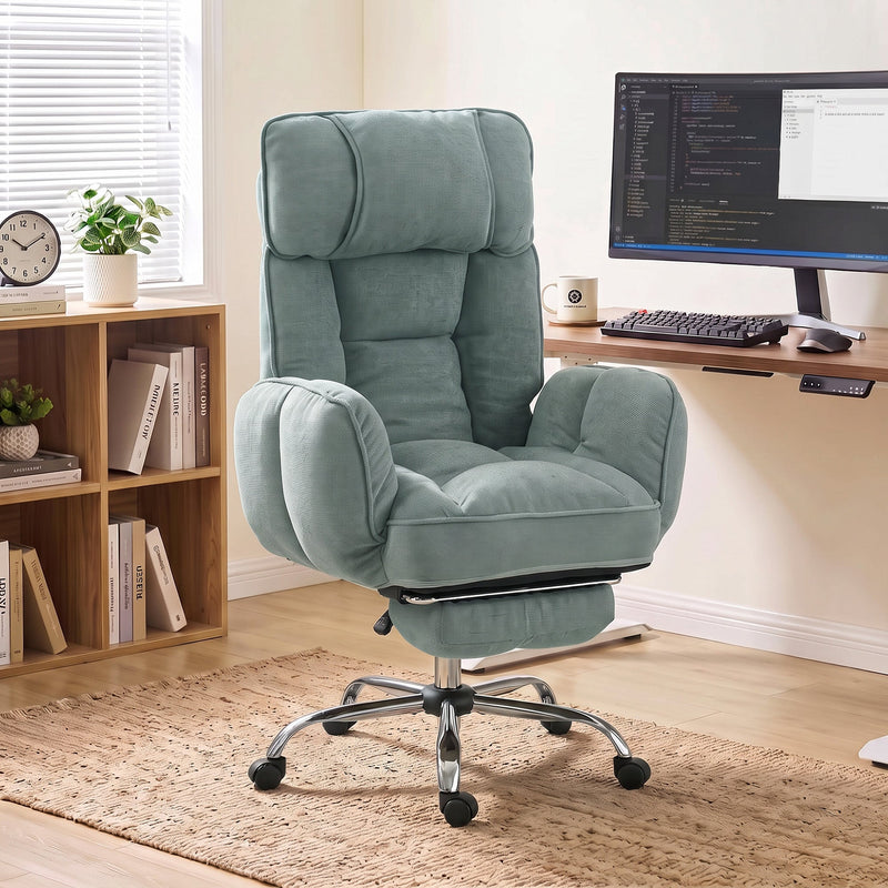 Light green executive office chair in a home study beside a wooden desk and bookcase
