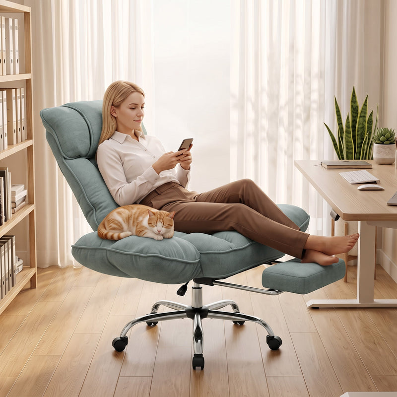 Woman reclining in the light green chair with the footrest out and a cat on her lap