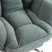 Close-up of the light green padded seat cushion and armrest