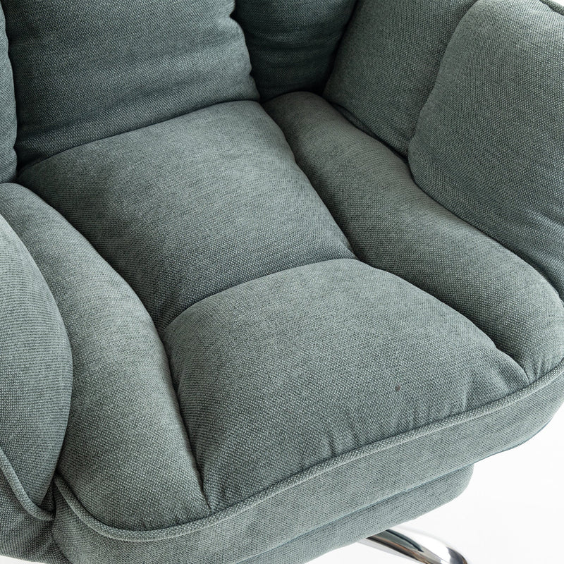 Close-up of the light green padded seat cushion and armrest