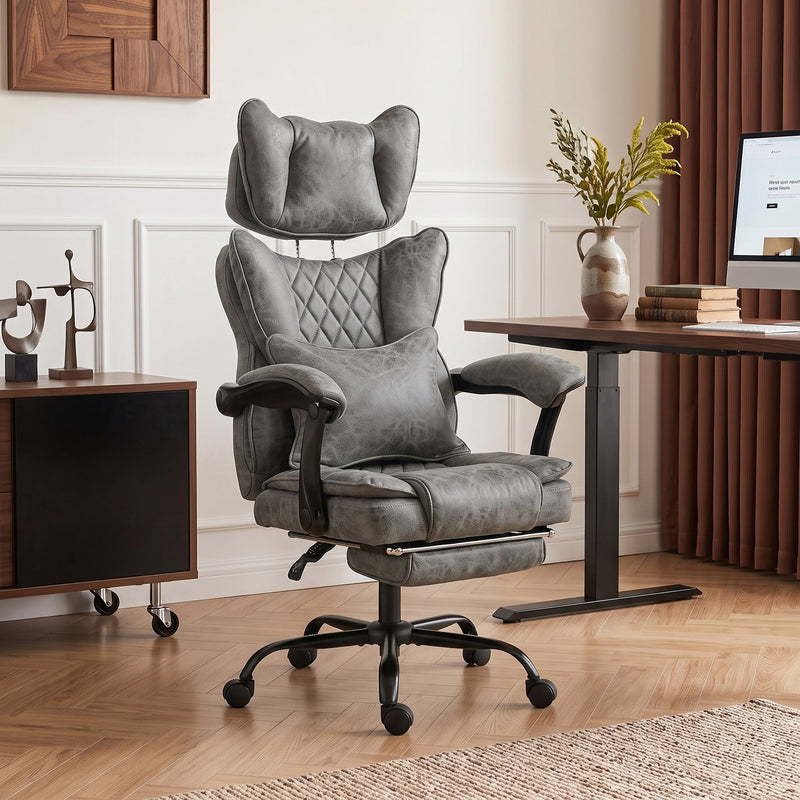 Grey executive office chair styled in a modern home office with a standing desk