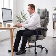Grey leathaire executive office chair shown from a side angle