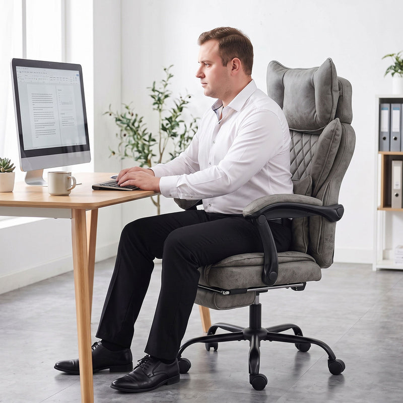 Grey leathaire executive office chair shown from a side angle