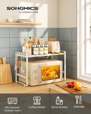 The microwave shelf in a tiled kitchen, with icons for microwave or toaster oven, coffee maker, spice bottles and utensils