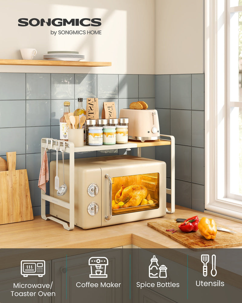 The microwave shelf in a tiled kitchen, with icons for microwave or toaster oven, coffee maker, spice bottles and utensils
