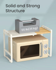 Illustration of a 25 kg weight resting on the shelf top while a cream microwave sits underneath