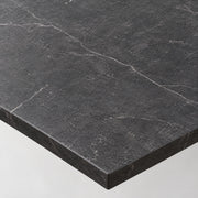 Close-up of the black marble effect tabletop and edge