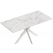 White marble effect extendable dining table with white steel cross legs on a plain background