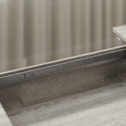 Close-up of the steel guide rail under the tabletop