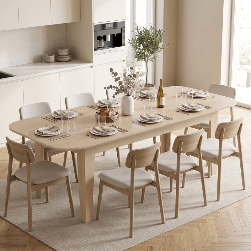 Dining table set with plates and glasses for 6 in a modern kitchen