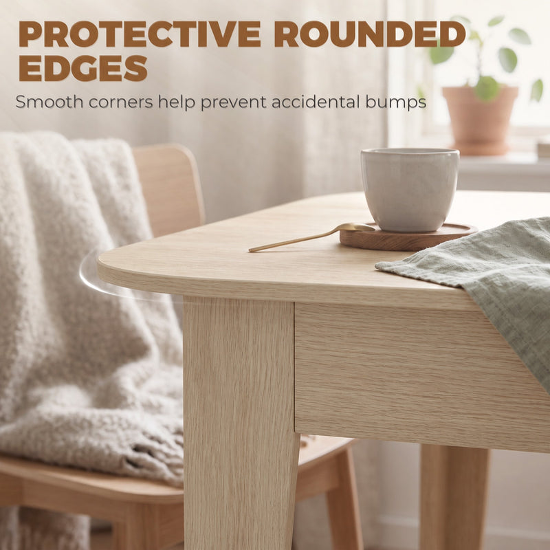 Rounded corner of the tabletop beside a chair with a blanket draped over it