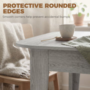 Close-up of the protective rounded tabletop corner with a cup and a knitted throw