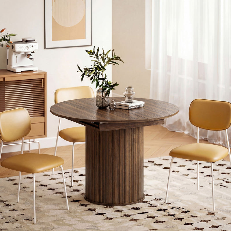 Round walnut dining table with three mustard chairs in a styled dining corner