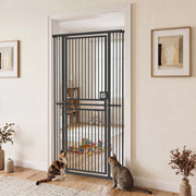 Black cat gate in a hallway doorway with two cats and a room of toys behind it