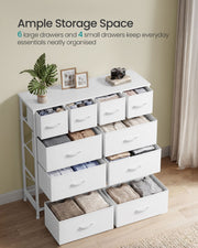 White 10 drawer chest with every drawer open and filled with folded clothes