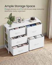 White 5 drawer chest with every drawer open and filled with folded clothes