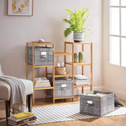 Lifestyle shot of the storage boxes on a wooden shelving unit in a living room