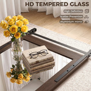Tempered glass mirror lying flat beside roses, books and reading glasses