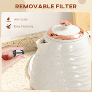 Hand lifting the removable anti-scale filter out of the kettle spout